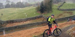 A very wet, snowy day with man mountain biking in Scotland