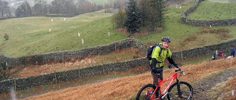 A very wet, snowy day with man mountain biking in Scotland