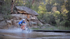 Mountain biking in australia - water crossing in mountain wellington, tasmania